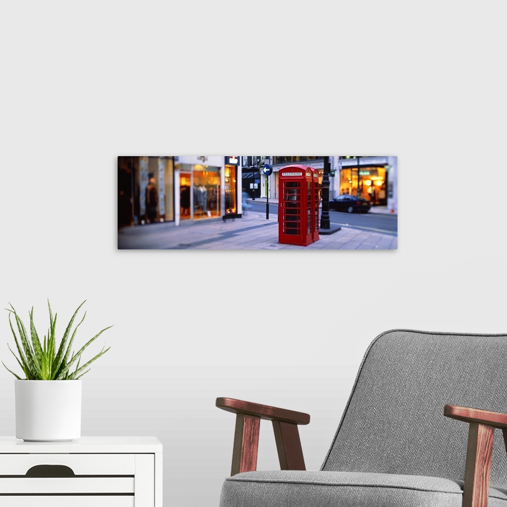 A modern room featuring Panoramic photograph of the Mayfair District in London, England, street side storefronts in the b...