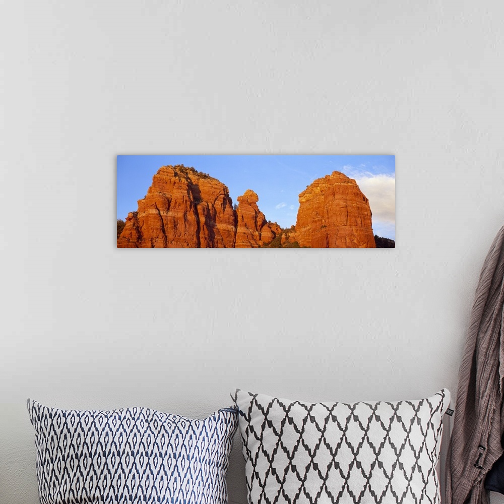 A bohemian room featuring Panoramic photograph of giant rock formations beneath an almost clear blue sky, in Sedona, Arizona.
