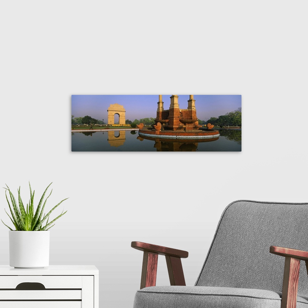A modern room featuring Reflection of a monument in water, India Gate, New Delhi, India