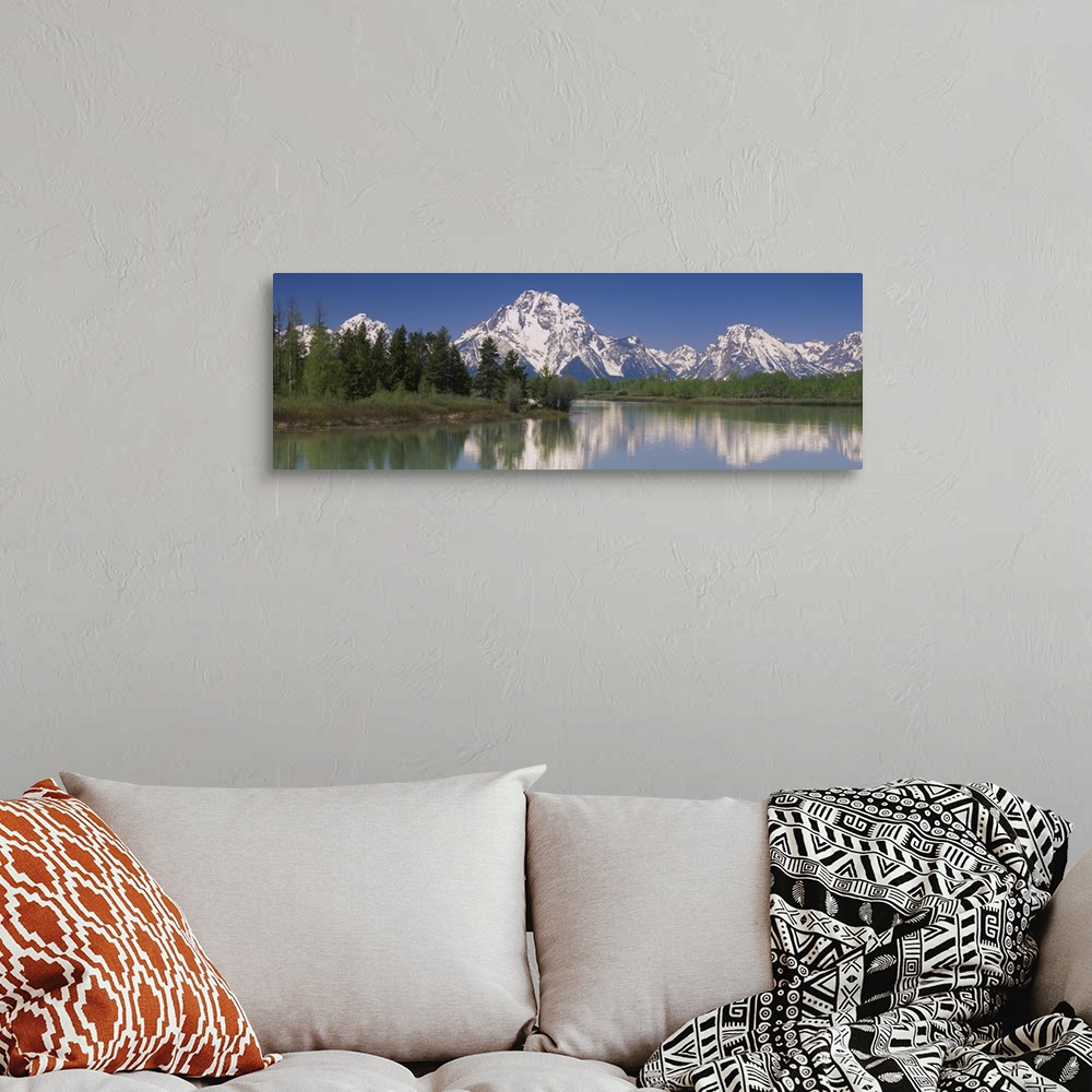A bohemian room featuring Reflection of a mountain range in water, Oxbow Bend, Grand Teton National Park, Wyoming