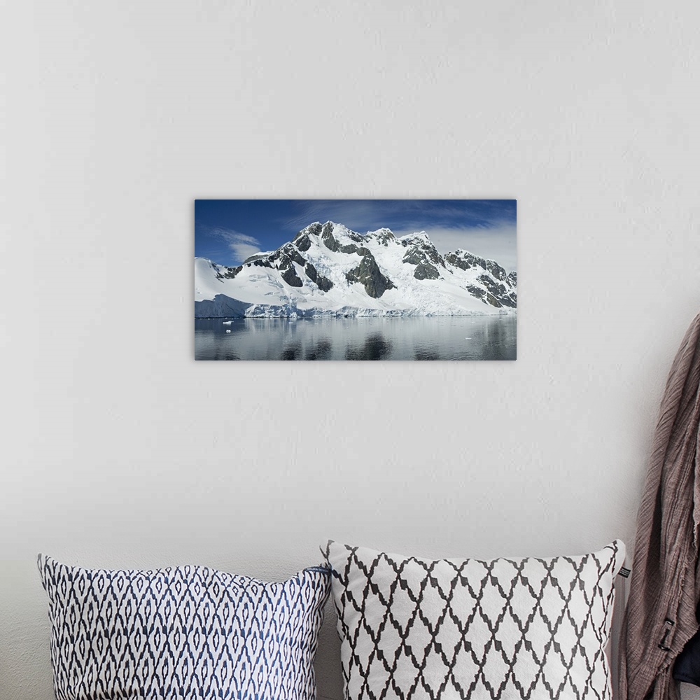 A bohemian room featuring Reflection of a snow covered mountain in water, Antarctic Peninsula, Antarctica