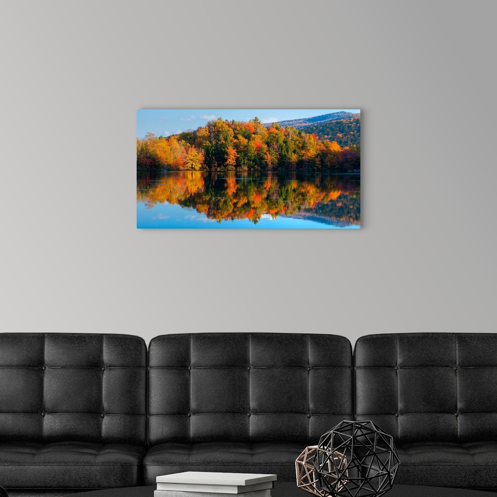 A modern room featuring Reflection of autumn trees in a lake, West Bolton, Quebec, Canada