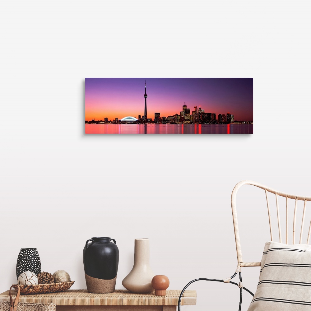 A farmhouse room featuring A panoramic photograph of the city skyline glowing in the night.