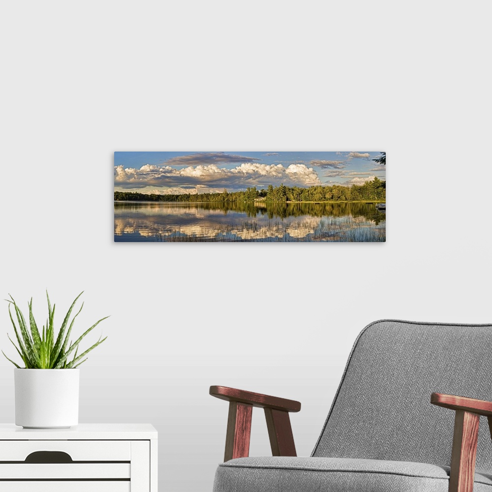 A modern room featuring Reflection of clouds in a lake, Edelweiss Lake, North Conway, New Hampshire