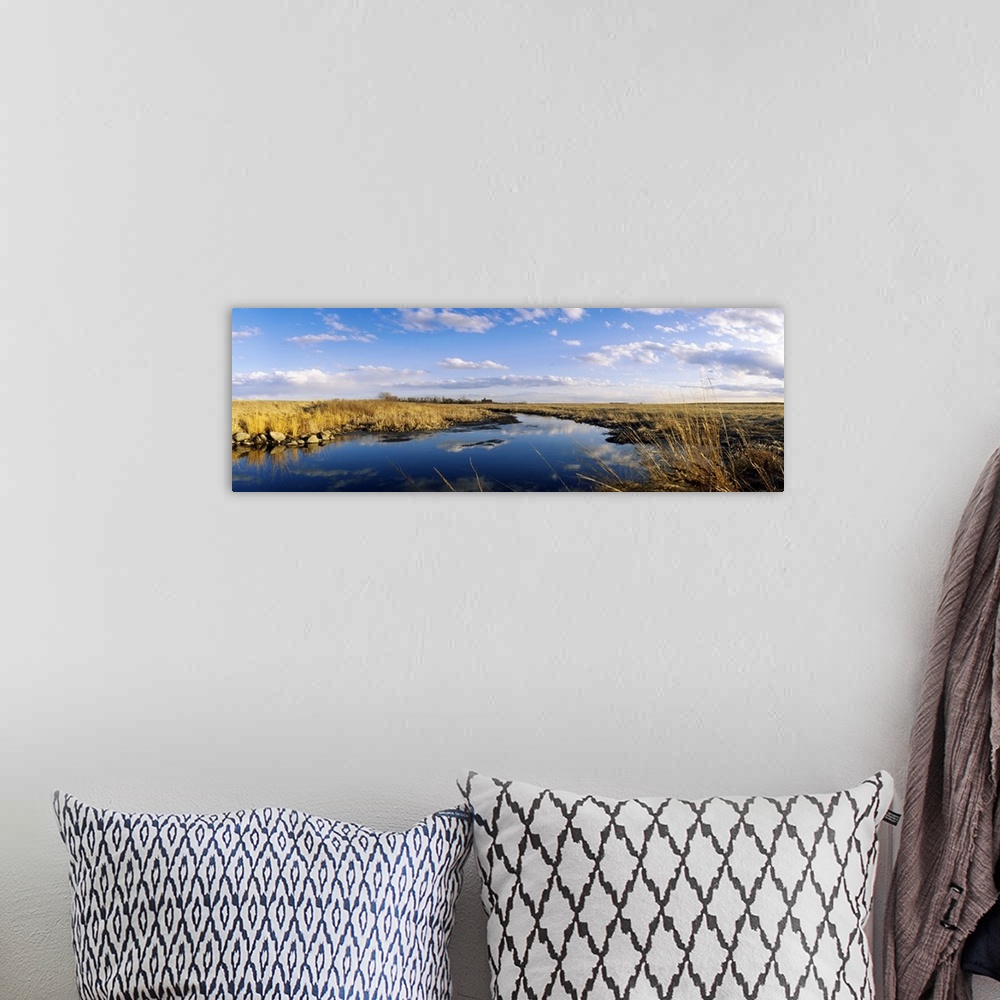 A bohemian room featuring Reflection of clouds in a lake, Prairie Pothole Region, North Dakota
