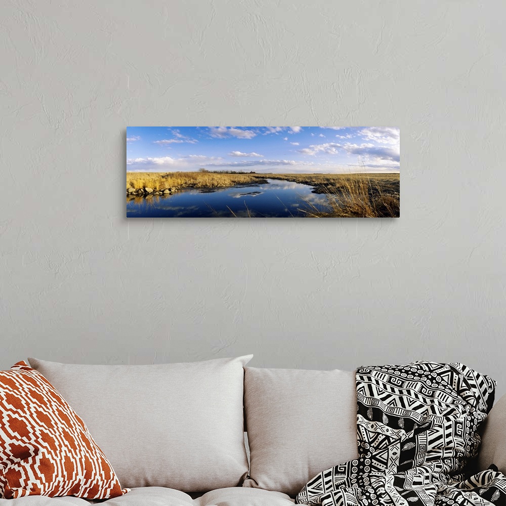 A bohemian room featuring Reflection of clouds in a lake, Prairie Pothole Region, North Dakota