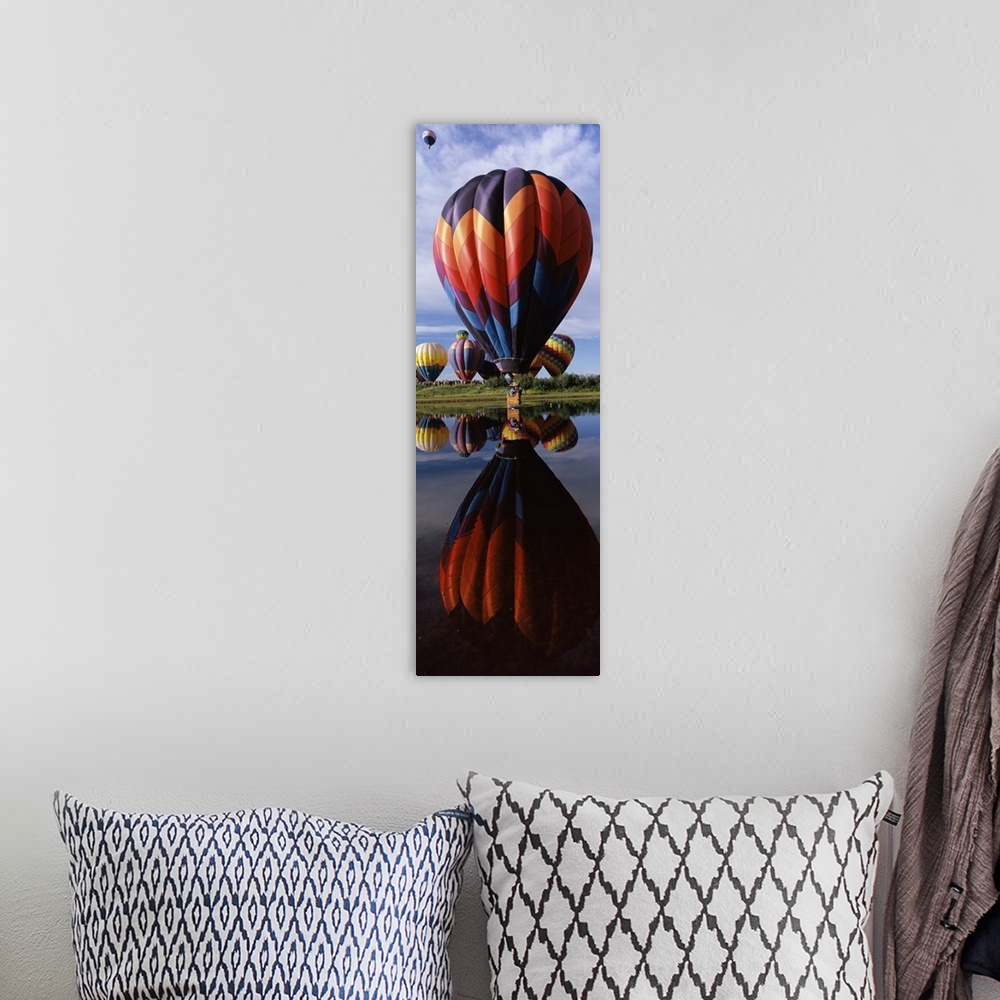 A bohemian room featuring Reflection of hot air balloons in a lake Hot Air Balloon Rodeo Steamboat Springs Routt County Col...