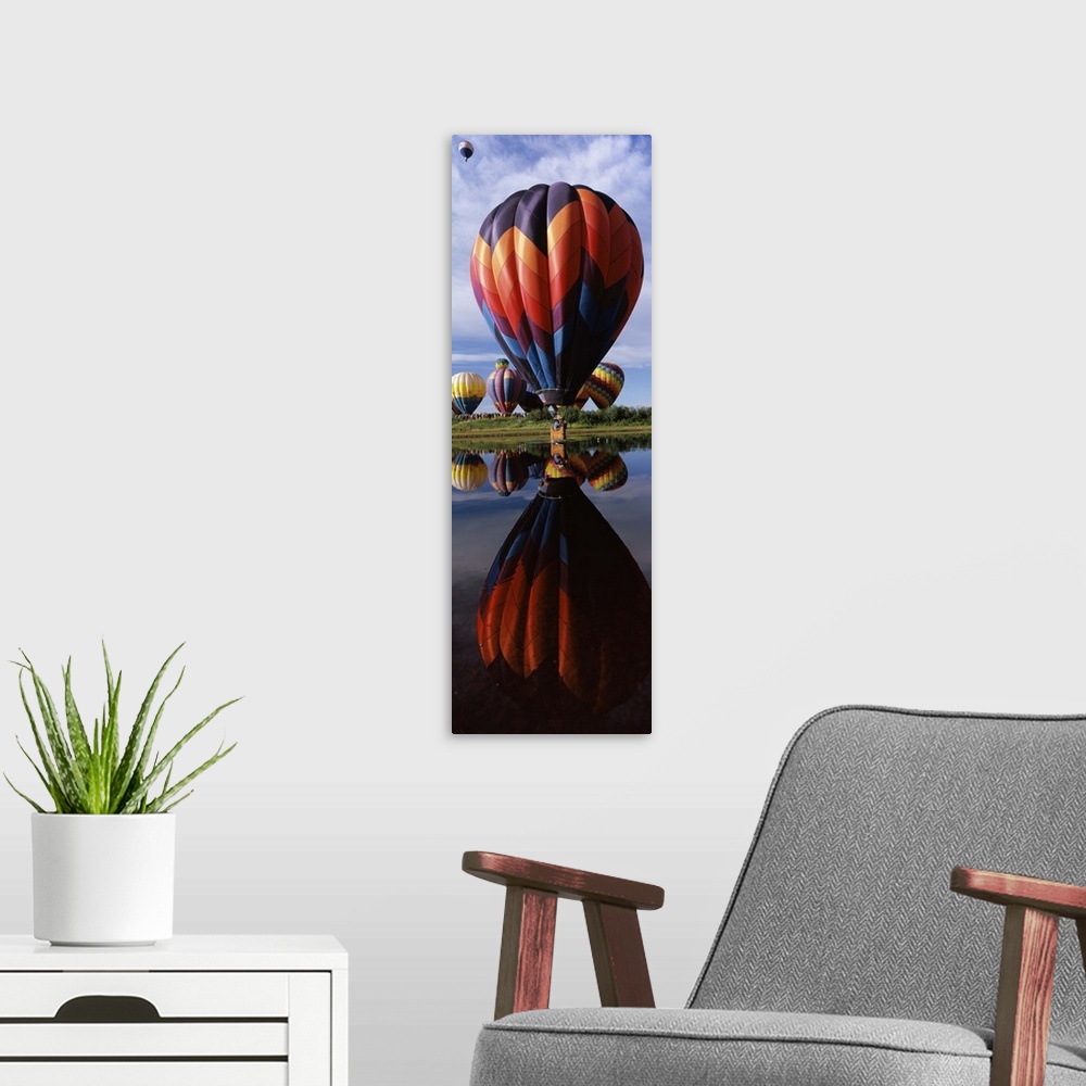A modern room featuring Reflection of hot air balloons in a lake Hot Air Balloon Rodeo Steamboat Springs Routt County Col...
