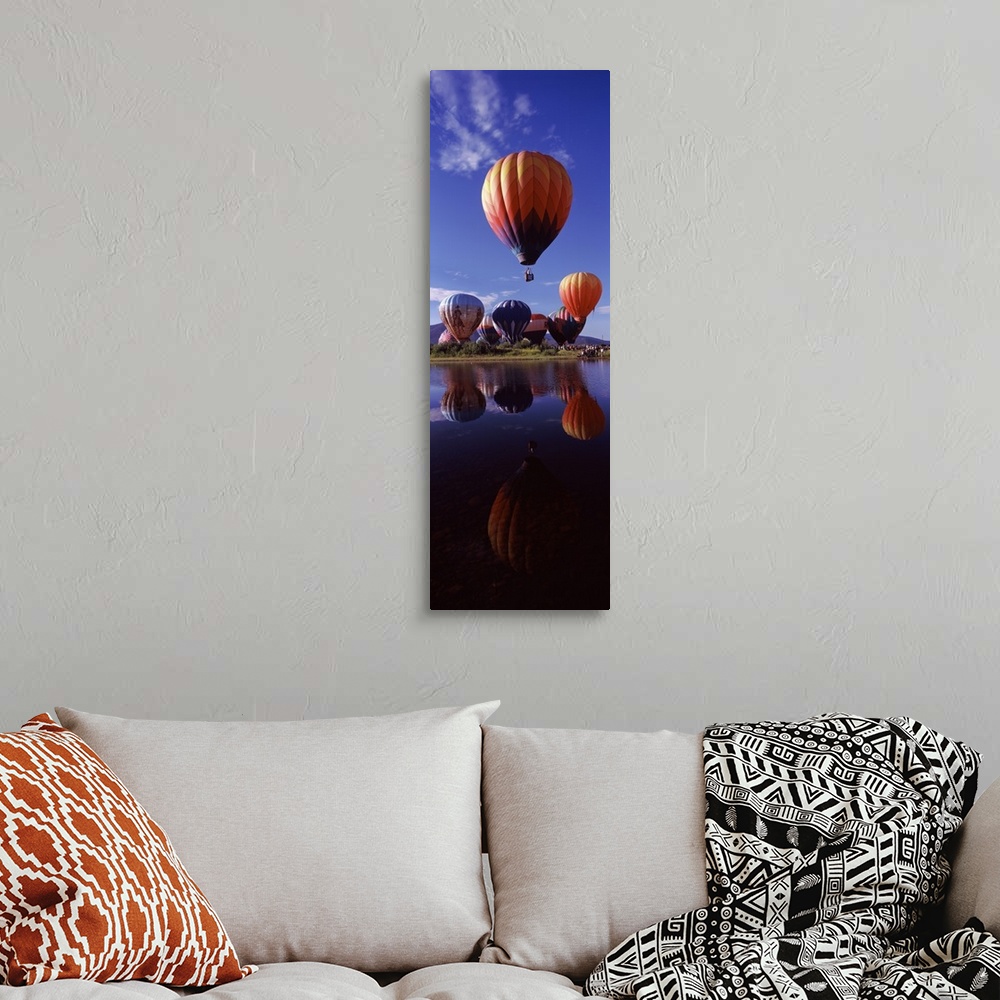 A bohemian room featuring Reflection of hot air balloons in a lake Hot Air Balloon Rodeo Steamboat Springs Routt County Col...