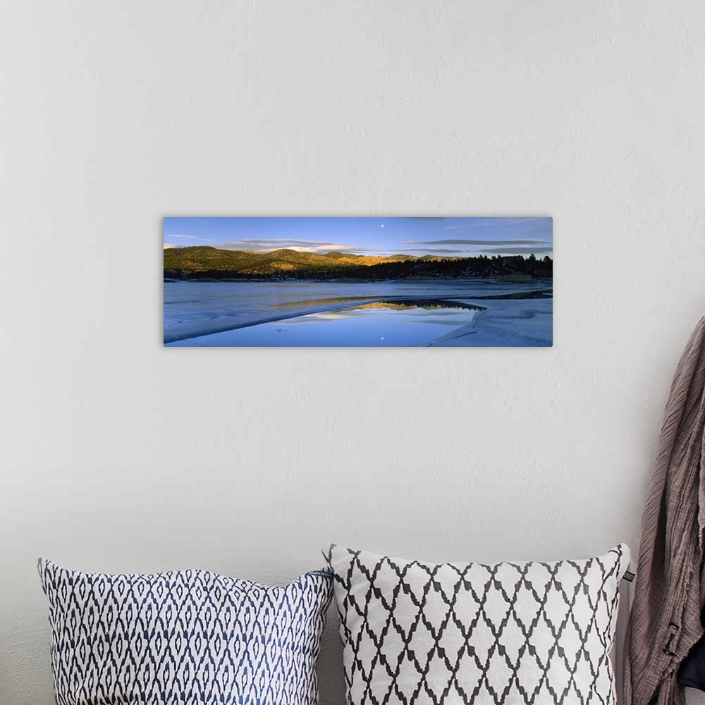 A bohemian room featuring Large photo on canvas of a lake with rolling hills in the distance and a moon shining bright in t...