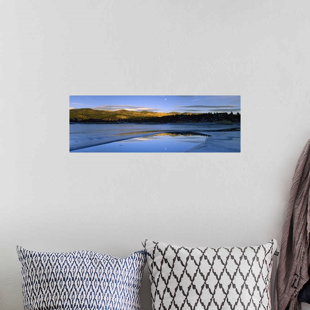 A bohemian room featuring Large photo on canvas of a lake with rolling hills in the distance and a moon shining bright in t...