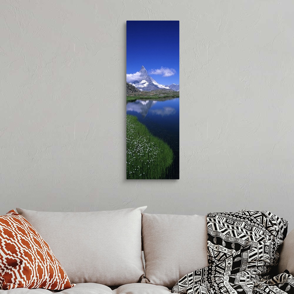 A bohemian room featuring Reflection of mountain in water, Riffelsee, Matterhorn, Switzerland
