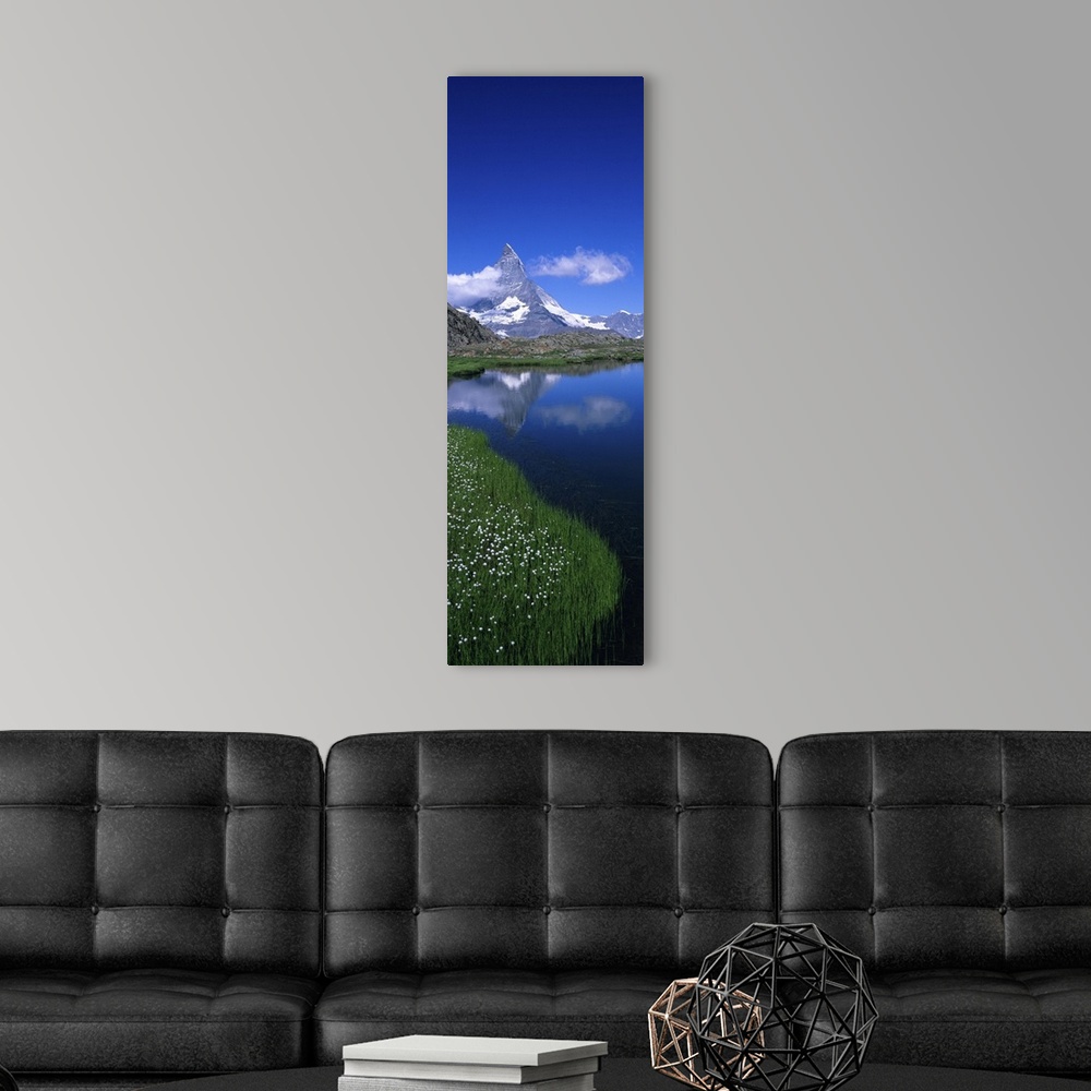 A modern room featuring Reflection of mountain in water, Riffelsee, Matterhorn, Switzerland