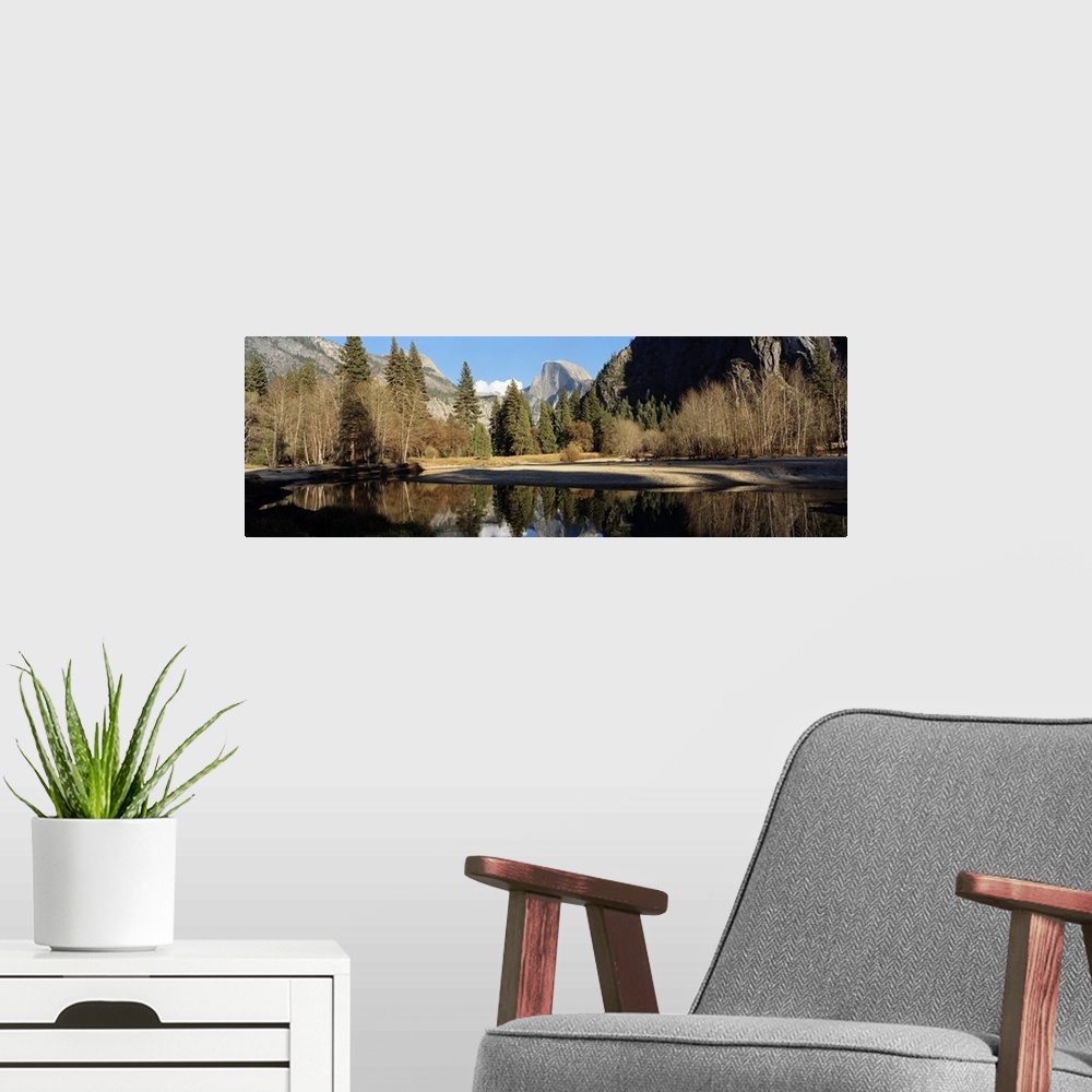 A modern room featuring Reflection of mountains and trees in a lake, Half dome, Yosemite National Park, California
