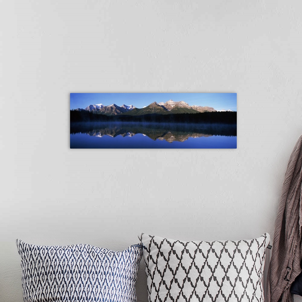 A bohemian room featuring Reflection of mountains in a lake, Lake Herbert, Banff National Park, Alberta, Canada