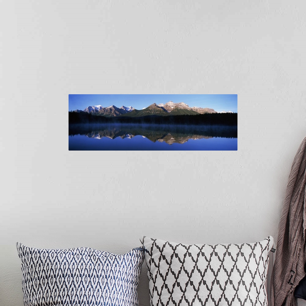 A bohemian room featuring Reflection of mountains in a lake, Lake Herbert, Banff National Park, Alberta, Canada