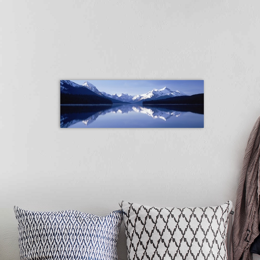 A bohemian room featuring Reflection of mountains in a lake, Maligne Lake, Jasper National Park, Alberta, Canada