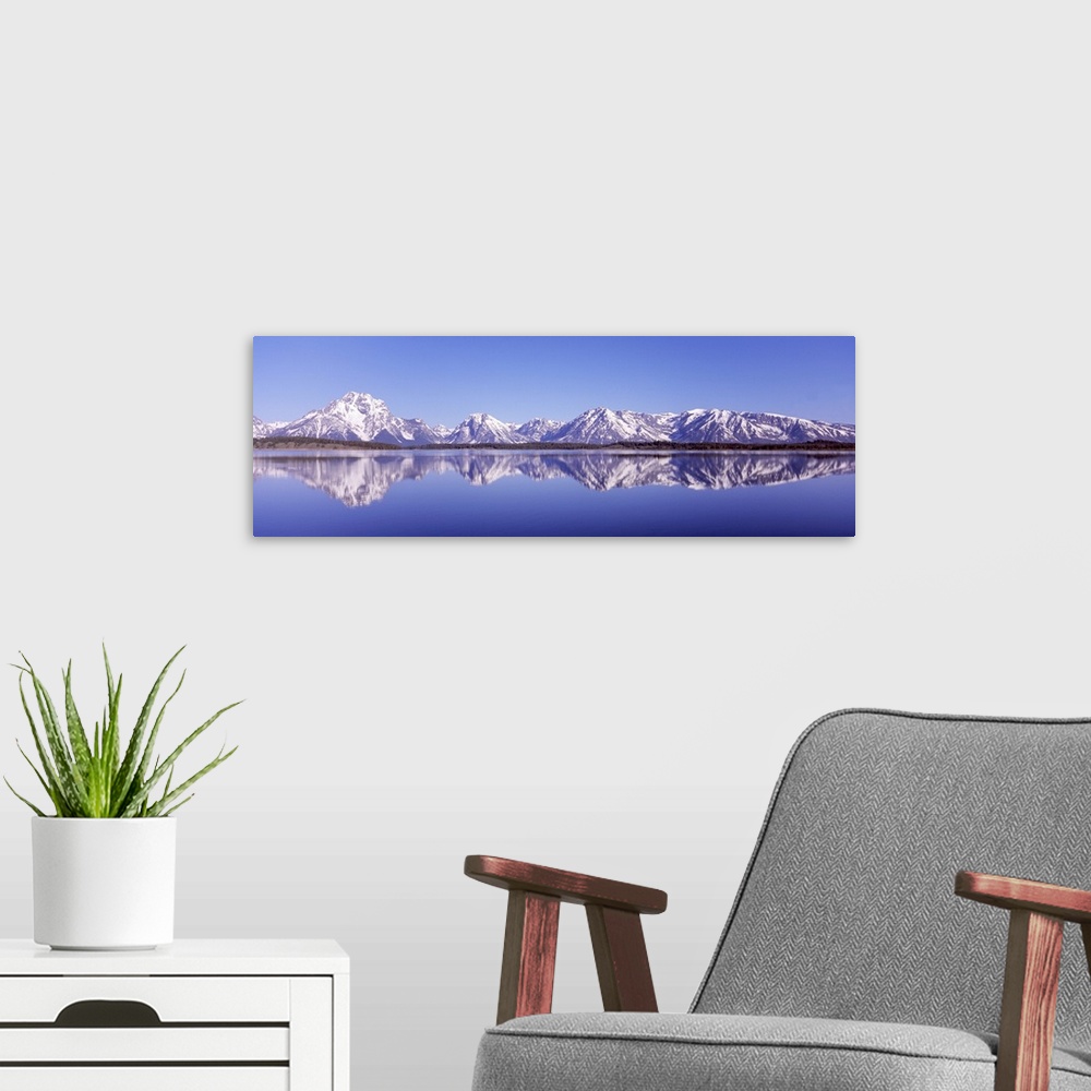 A modern room featuring Reflection of mountains in a lake, Teton Range, Jackson Lake, Grand Teton National Park, Wyoming,