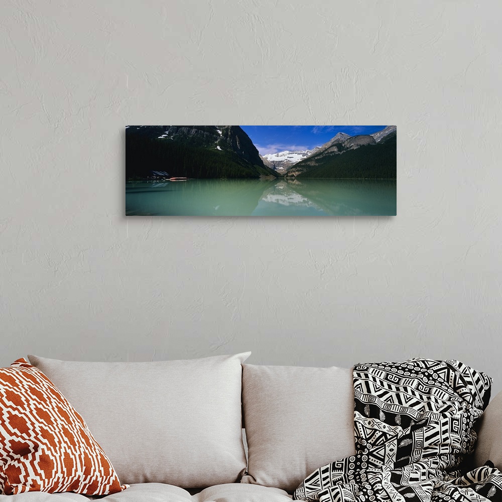 A bohemian room featuring Reflection of mountains in water, Lake Louise, Banff National Park, Alberta, Canada