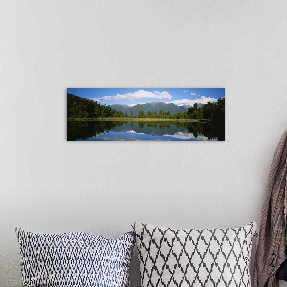 A bohemian room featuring Reflection of mountains in water, Lake Matheson, Westland National Park, South Island, New Zealand