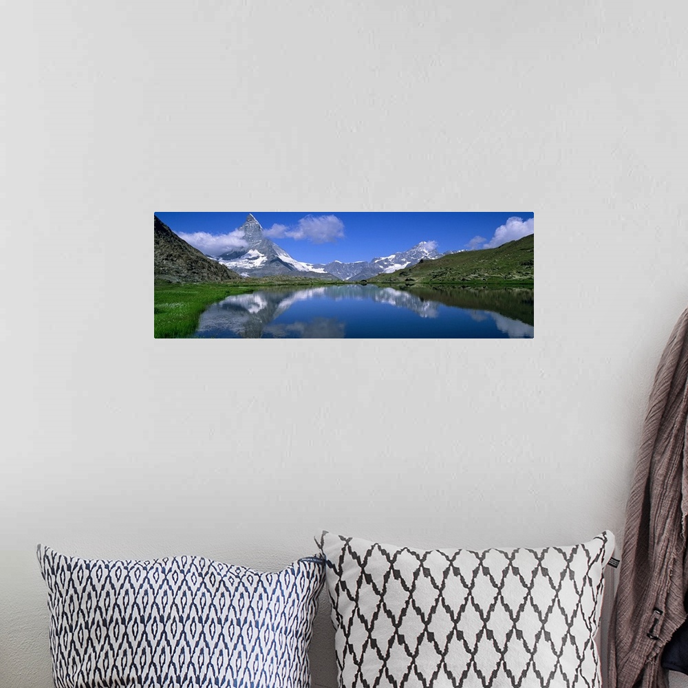 A bohemian room featuring Reflection of mountains in water, Riffelsee, Matterhorn, Switzerland