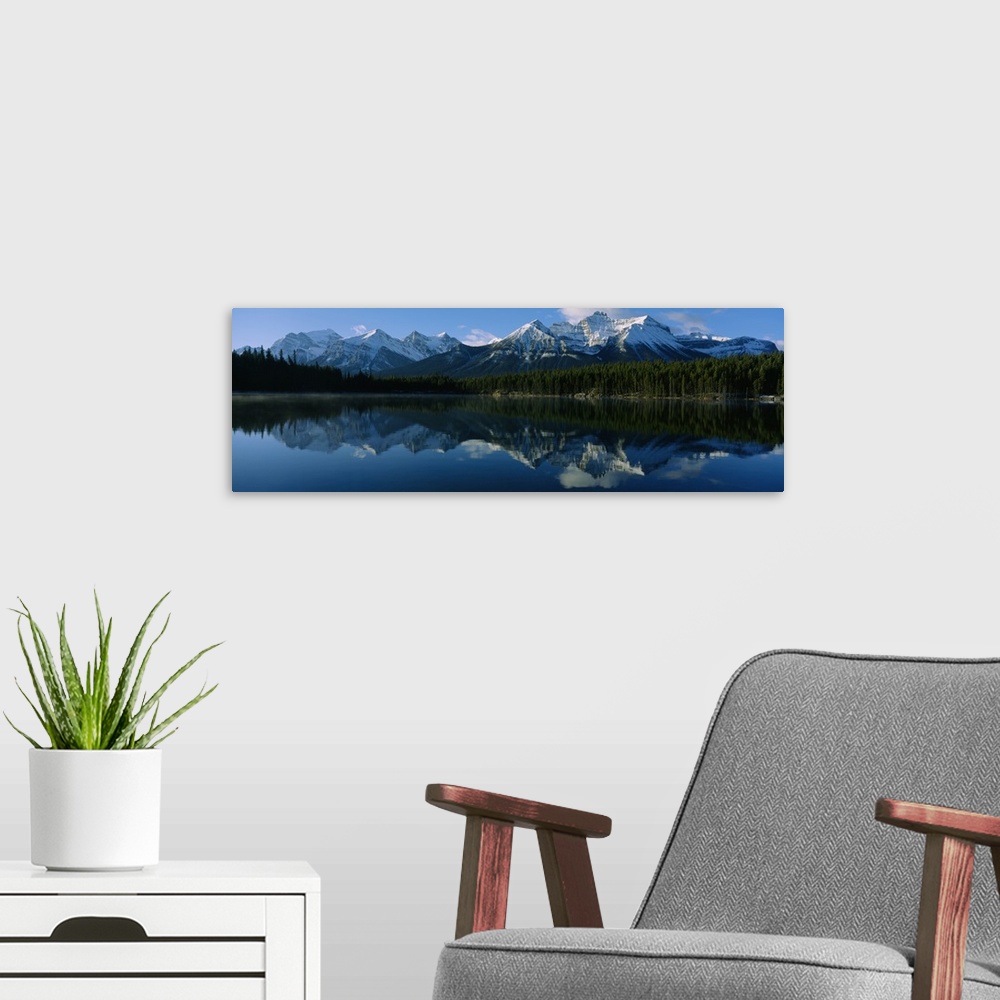 A modern room featuring Reflection of mountains on water, Herbert Lake, Banff National Park, Alberta, Canada