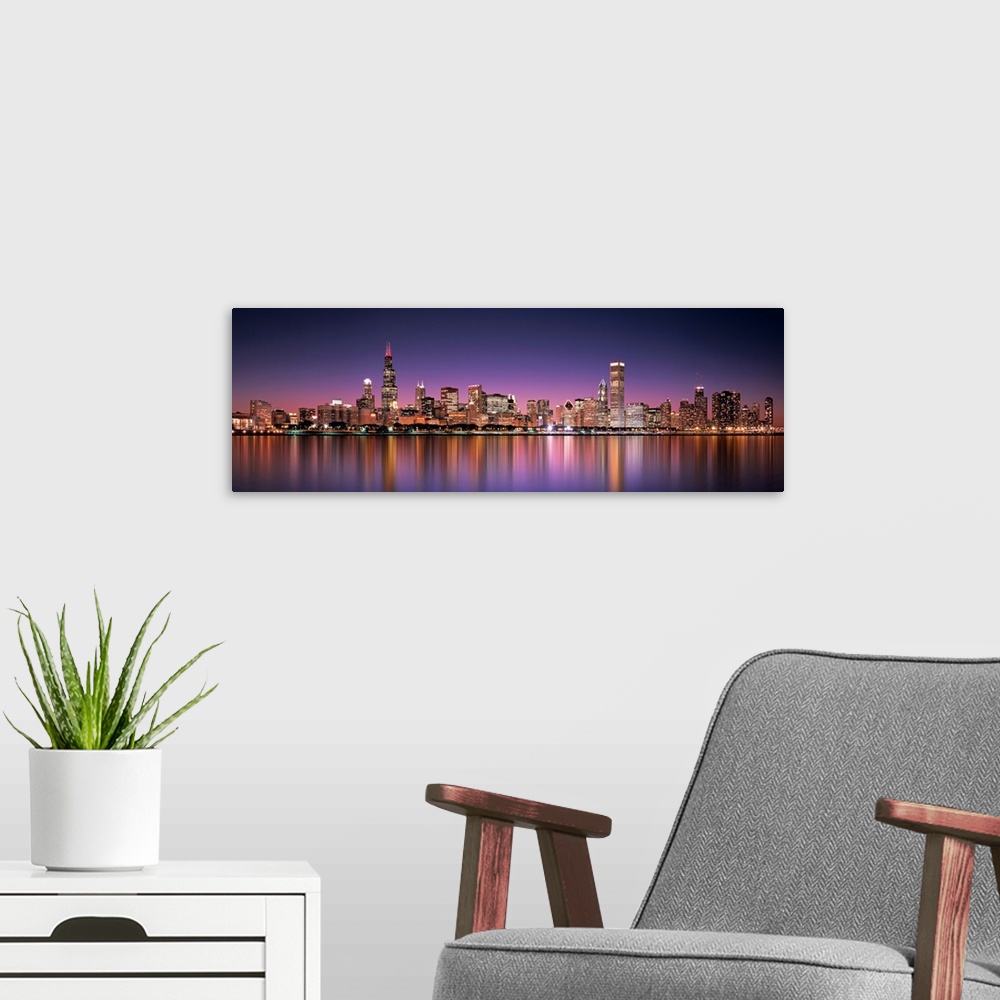 A modern room featuring Panoramic photograph of the Chicago, Illinois skyline filled with skyscrapers reflecting onto Lak...