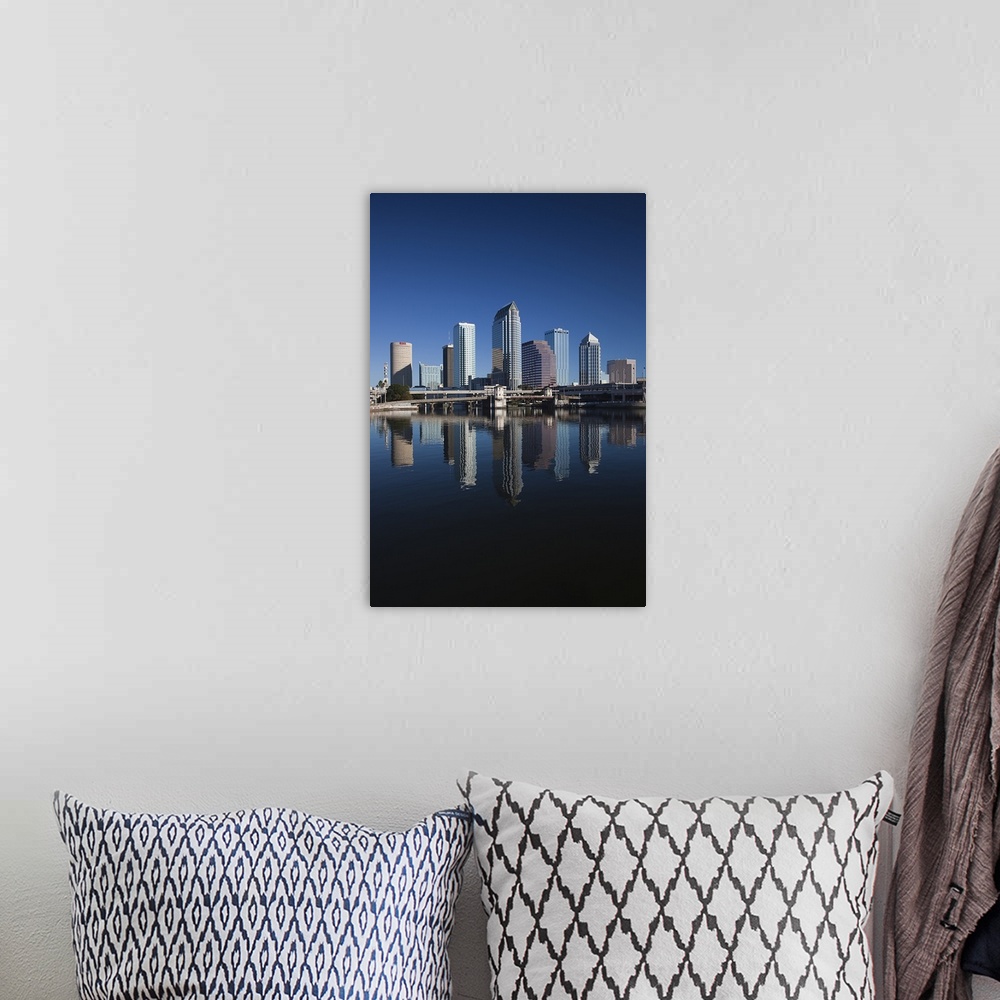 A bohemian room featuring Tall image on canvas of buildings in Tampa reflected in the waterfront.