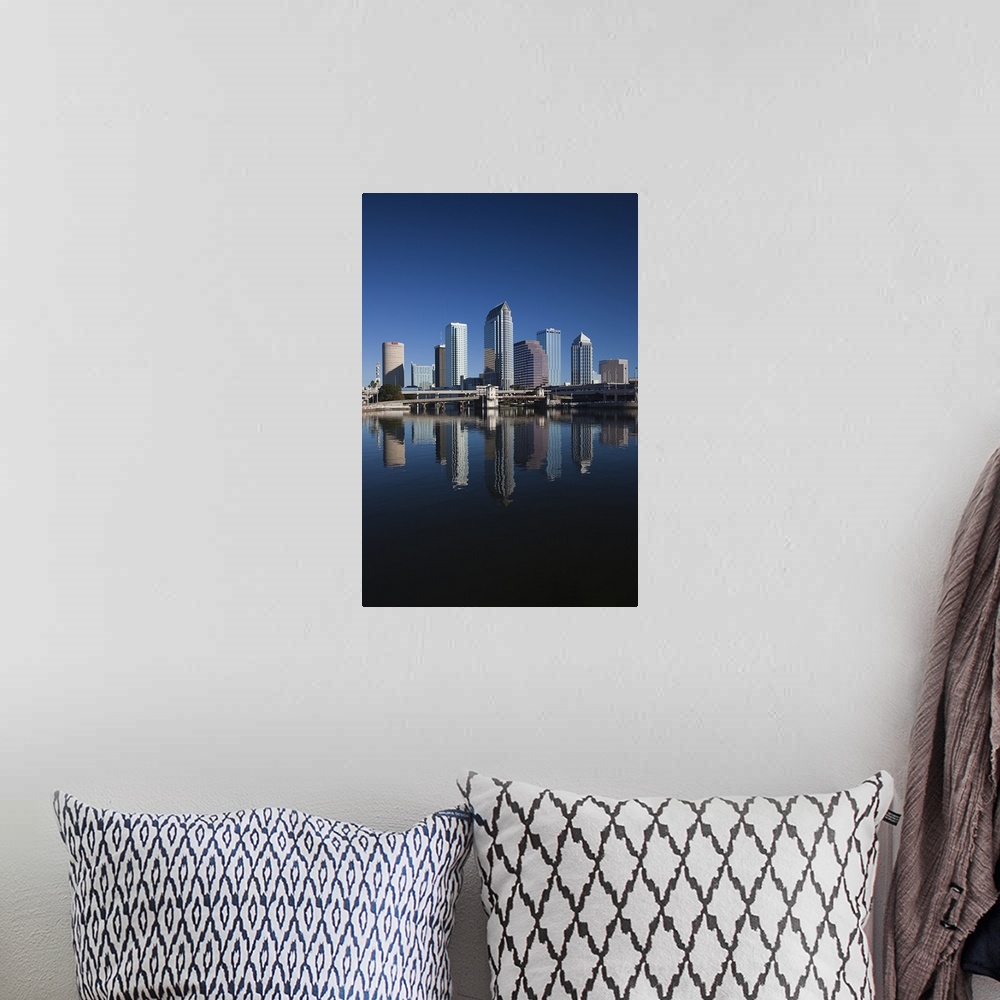 A bohemian room featuring Tall image on canvas of buildings in Tampa reflected in the waterfront.