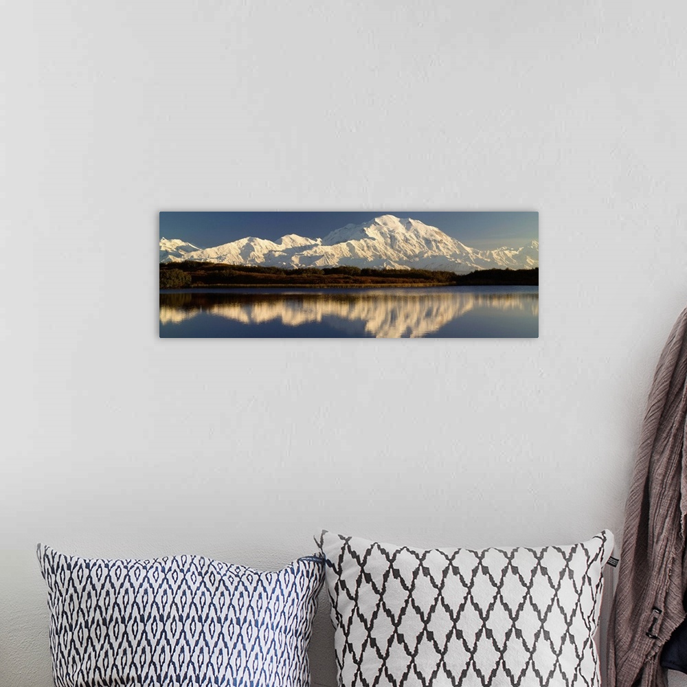 A bohemian room featuring Reflection of snow covered Mt McKinley in water, Denali National Park, Alaska