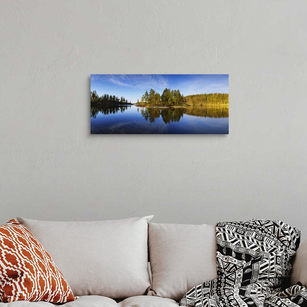 A bohemian room featuring Reflection of trees in a lake, Lake Saimaa, Puumala, Finland