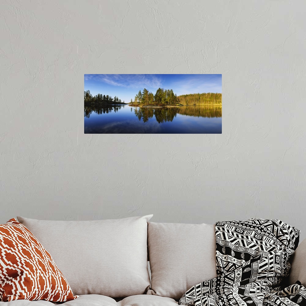 A bohemian room featuring Reflection of trees in a lake, Lake Saimaa, Puumala, Finland
