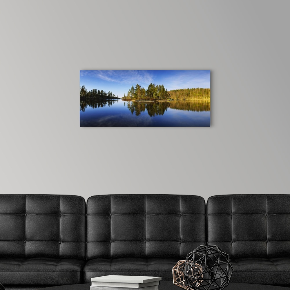 A modern room featuring Reflection of trees in a lake, Lake Saimaa, Puumala, Finland