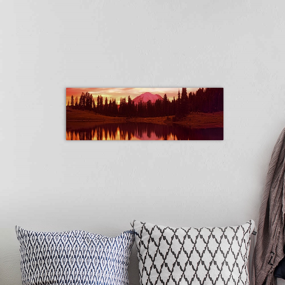 A bohemian room featuring Panoramic image of Mount Rainier reflected with trees in a lake printed on canvas.
