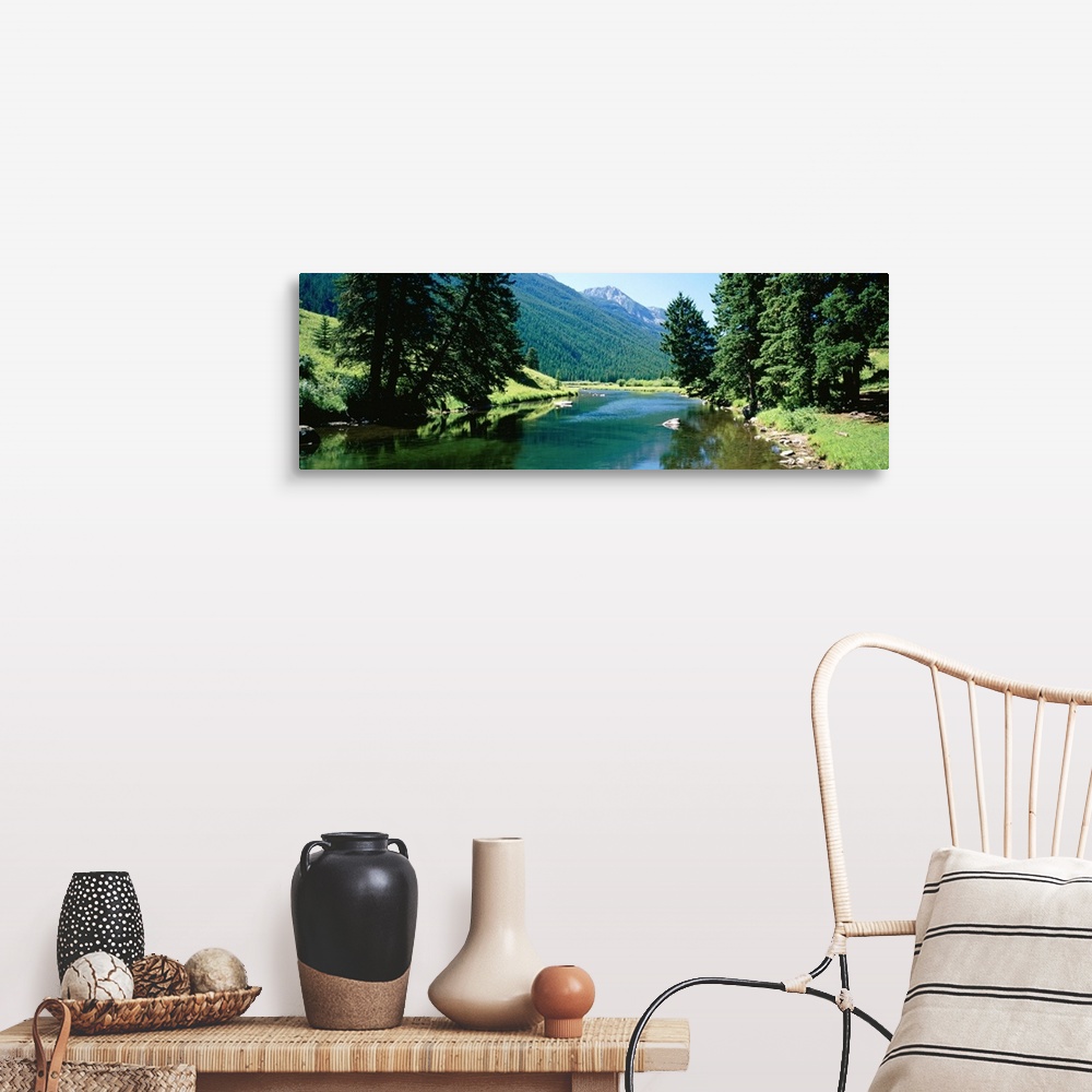 A farmhouse room featuring Panoramic photograph looking down the Boulder River, surrounded by trees and mountain landscape i...