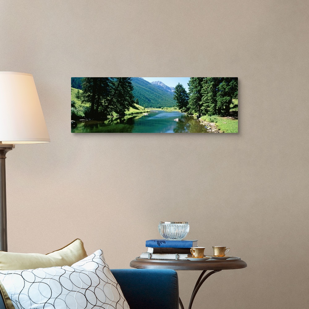 A traditional room featuring Panoramic photograph looking down the Boulder River, surrounded by trees and mountain landscape i...