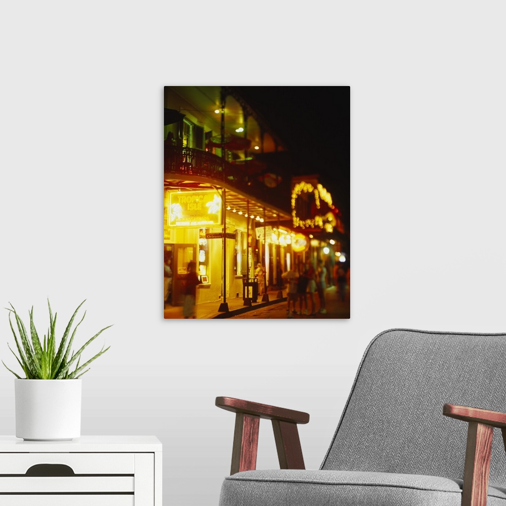 A modern room featuring Restaurant lit up at night, Bourbon Street, New Orleans, Louisiana