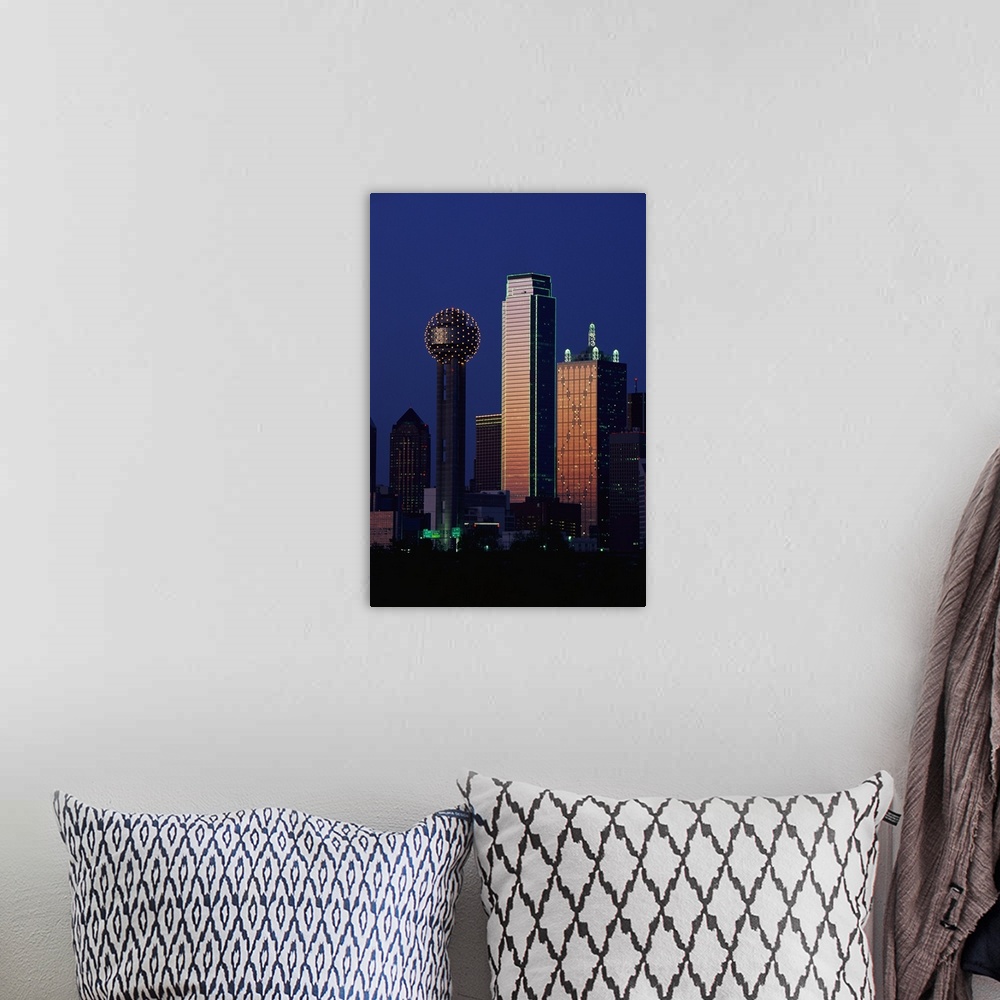 A bohemian room featuring This large vertical piece is a photograph that has been taken of the Dallas skyline with the buil...