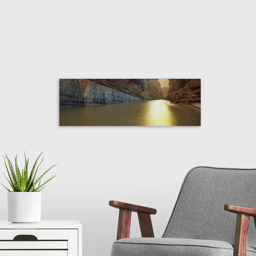 A modern room featuring Panoramic picture looking down the Rio Grande River that cuts between immense cliffs.