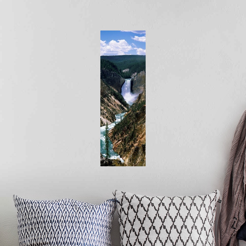 A bohemian room featuring Vertical panoramic of a large waterfall at Yellowstone National Park in Wyoming.