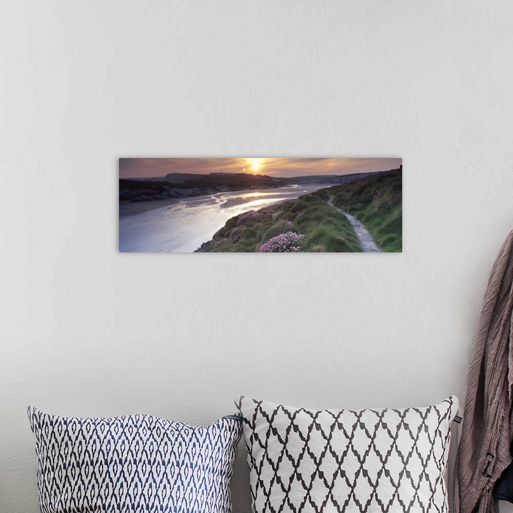 A bohemian room featuring River flowing at sunset Porth Newquay Cornwall England