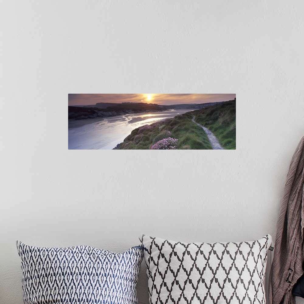 A bohemian room featuring River flowing at sunset Porth Newquay Cornwall England