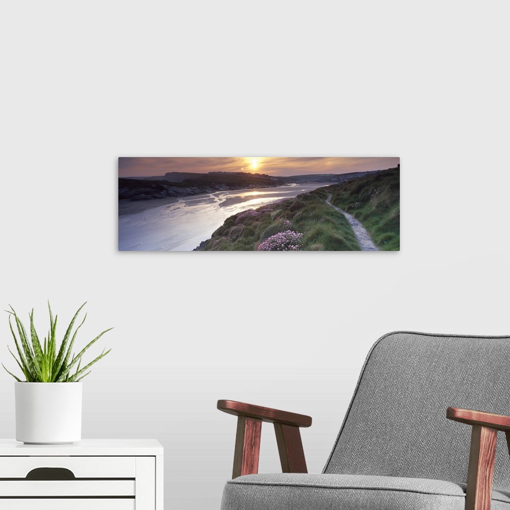 A modern room featuring River flowing at sunset Porth Newquay Cornwall England