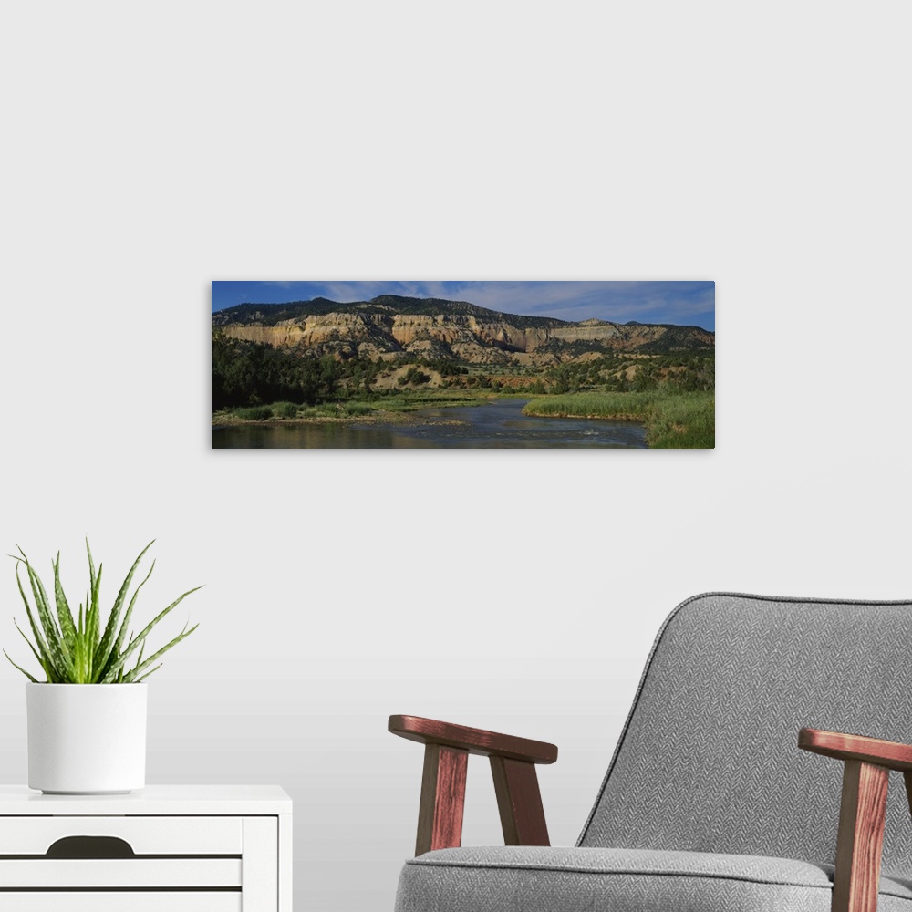 A modern room featuring River in front of a mountain, Chama River Canyon Wilderness Area, New Mexico