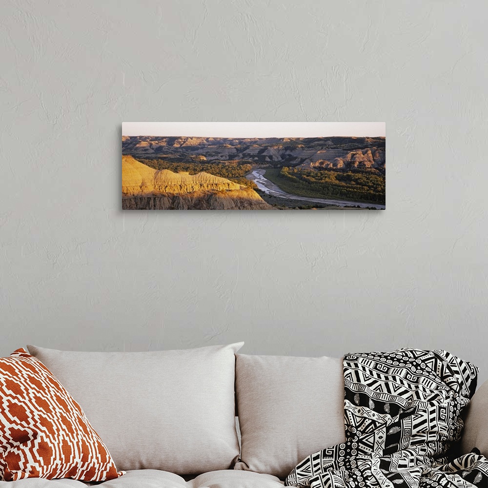 A bohemian room featuring River passing through a landscape, Little Missouri River, Badlands, Theodore Roosevelt National P...