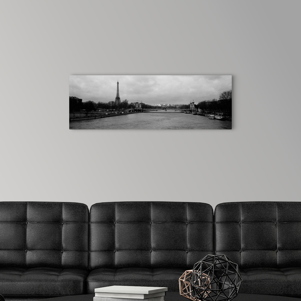 A modern room featuring Panoramic photograph taken over the Seine river with the Eiffel tower in the distance and skewed ...