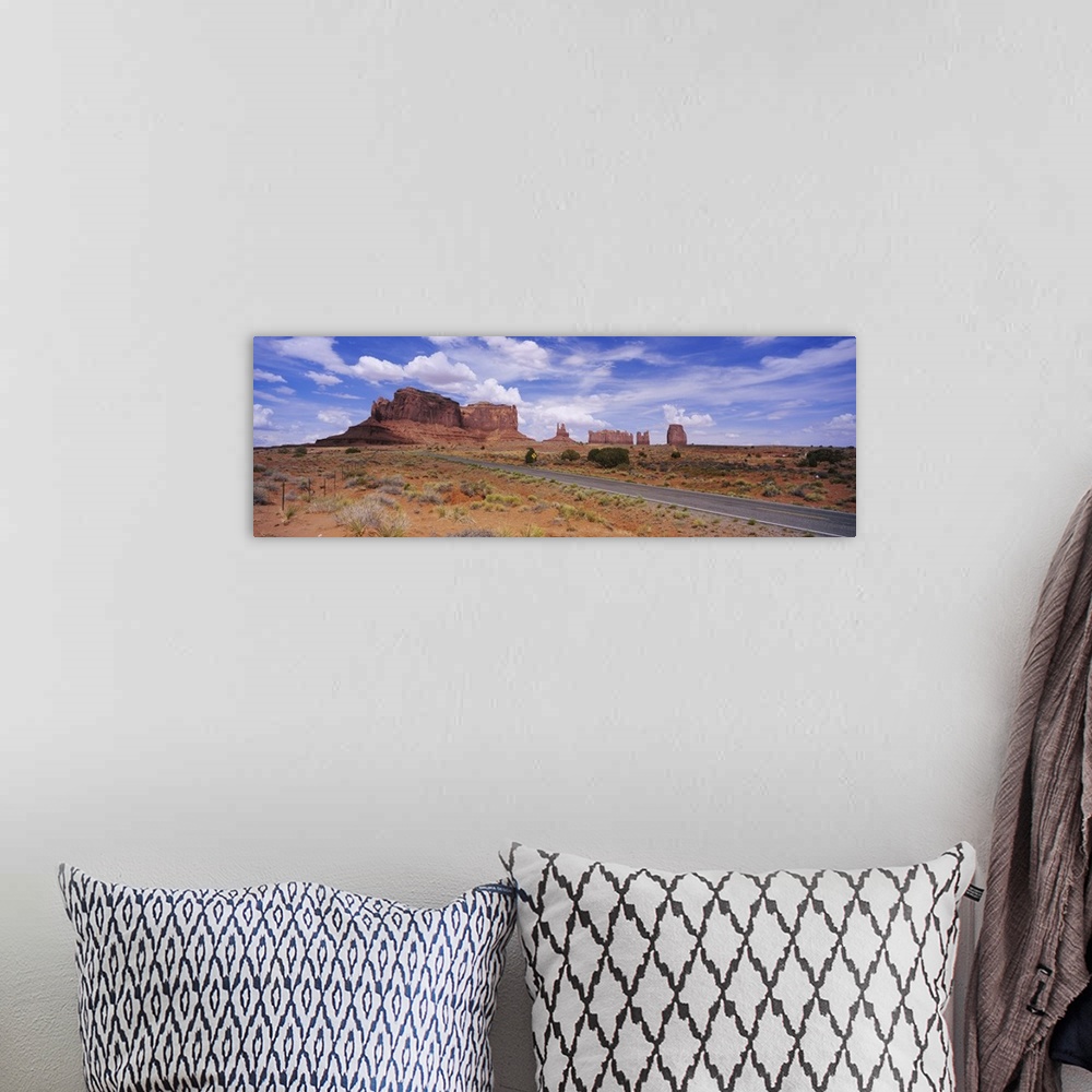 A bohemian room featuring Road passing through a desert, Monument Valley Tribal Park