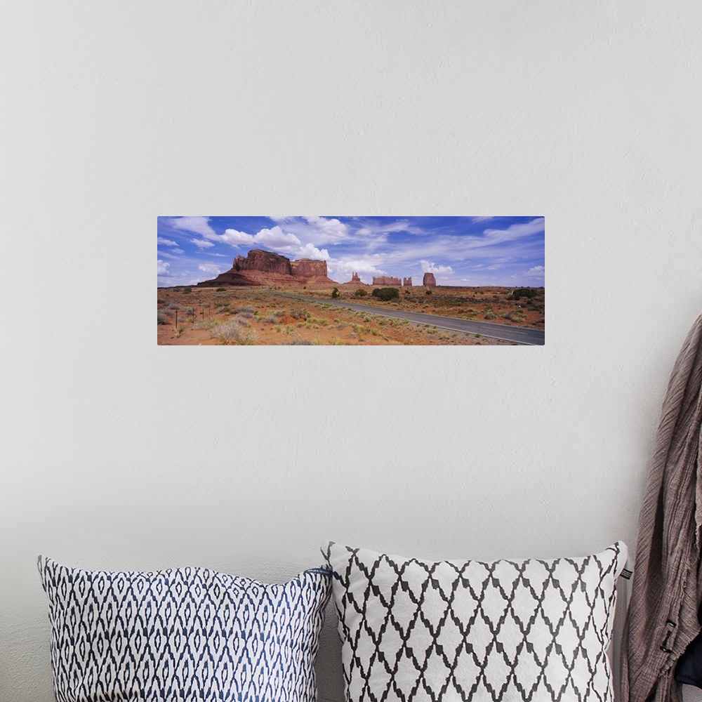 A bohemian room featuring Road passing through a desert, Monument Valley Tribal Park