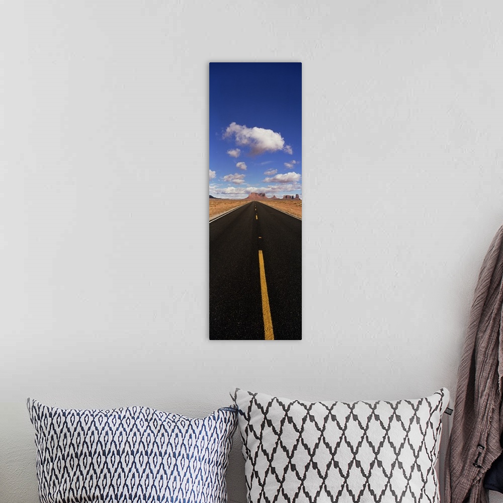 A bohemian room featuring Road shot w/ clouds Monument Valley  AZ