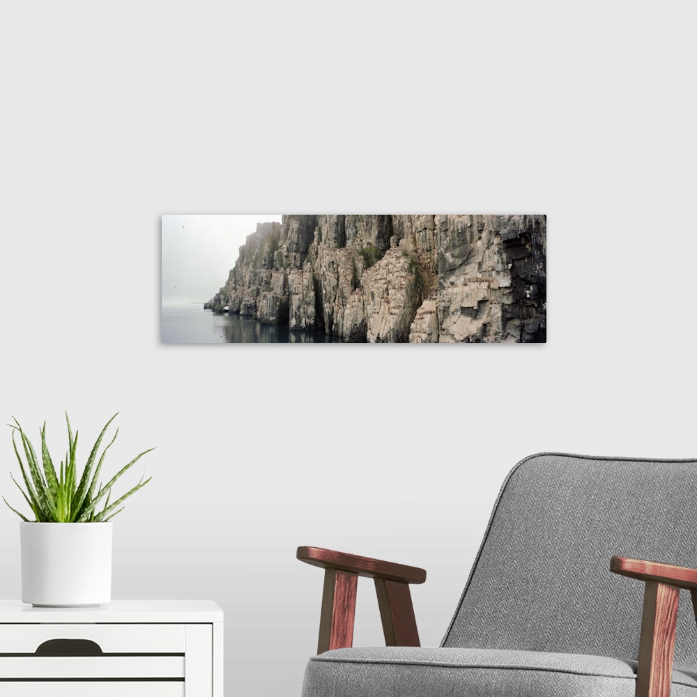 A modern room featuring Rock formations at the coast, Bear Island, Svalbard, Norway